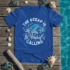 The Ocean Is Calling t-shirt design with a stylized shark and wave graphics, featuring white and blue tribal patterns