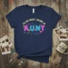 The One Where I Become An A.U.N.T text in neon style on a dark blue t-shirt with cosmic graphics