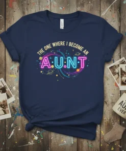 The One Where I Become An A.U.N.T text in neon style on a dark blue t-shirt with cosmic graphics