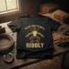 The Only Squat I'm Doin' Is Biddly text on a t-shirt with a cowboy frog graphic