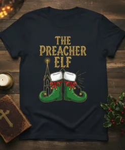 The Preacher Elf Christmas T-Shirt featuring golden text and green elf boots with red bows