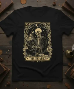 The Reader t-shirt design with a skeleton reading a book, tarot card style, moon, butterflies, and floral accents