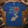 T-shirt with the quote "the road to my heart is paved in paw prints" and a decorative heart with a