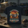 The Strongest Steel Is Forged In The Fire Of A Dumpster quote on a navy t-shirt with a flaming dumpster