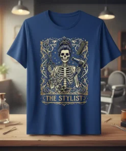 The Stylist T-Shirt featuring a skeleton hairdresser holding scissors and a hairdryer, adorned with floral accents