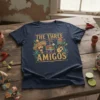 The Three Amigos t-shirt design with sombrero, piñata, guitar, and maracas graphics