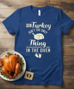 The Turkey Ain't the Only Thing In The Oven maternity t-shirt with turkey graphic and baby feet