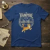 The Vampire The Frightened Feline text with a cute orange cat and bat graphic on a blue t-shirt