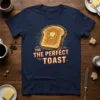 Navy t-shirt featuring the text "THE THE PERFECT TOAST" above a graphic of buttered toast