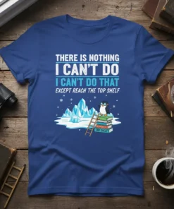 Blue t-shirt with text "There Is Nothing I Can't Do Except Reach The Top Shelf" and a penguin on books