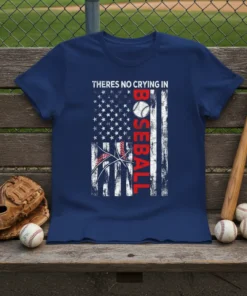 Theres No Crying In Baseball text with distressed American flag graphic on a navy blue t-shirt