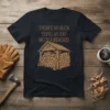 T-shirt with the text "There's No Such Thing As Too Much Firewood" above a drawing of a log shed full
