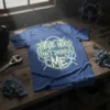 Blue t-shirt with "THESE HOES DON'T DESERVE ME" text in green and white, surrounded by barbed wire graphic
