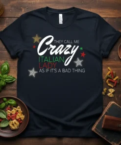 Black t-shirt with white and green text that reads "THEY CALL ME Crazy ITALIAN LADY AS IF IT'S A BAD