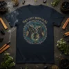 They Can't Burn Us All quote with phoenix and witches design on a navy t-shirt