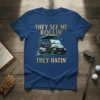 Golf cart t-shirt with gold text "THEY SEE ME ROLLIN' THEY HATIN'" and a graphic of a golf cart