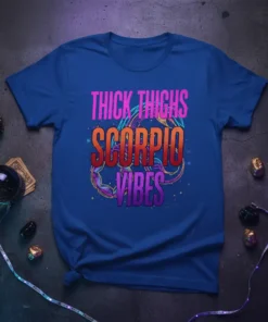 Thick Thighs Scorpio Vibes text with a scorpion graphic on a blue t-shirt, astrology theme