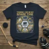 T-shirt graphic with text "Things I Do In My Spare Time Hockey" and circular icons related to hockey activities