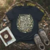 T-shirt with quote "THINGS I TRIP ON WHILE HIKING... ROOTS, ROCKS, MY OWN FEET, A LEAF, MY SHADOW" in a