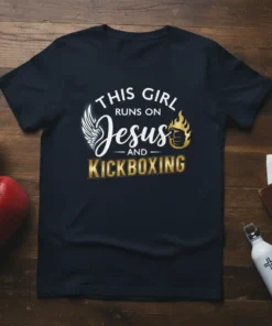 This Girl Runs On Jesus And Kickboxing text design on a navy t-shirt with wings and a flaming fist graphic