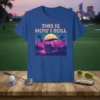 This Is How I Roll golf cart design with retro sunset and palm trees, on a blue t-shirt
