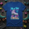 This is How I Roll text with retro roller skate graphic on a royal blue t-shirt