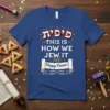 Blue t-shirt with Hebrew text 'Pik'at', "This Is How We Jew It", and "Happy Purim!" in white and red with