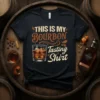 Black t-shirt with "THIS IS MY BOURBON Tasting Shirt" text and a glass of bourbon graphic