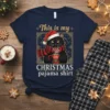 This is my CHRISTMAS pajama shirt design with a black cat wearing a Santa hat and scarf holding a mug