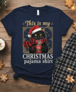This is my CHRISTMAS pajama shirt design with a black cat wearing a Santa hat and scarf holding a mug
