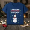 This Is My Christmas Pajama Shirt text with a snowman graphic and cannabis leaf accents