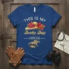 This Is My Derby Day Dress text with a straw hat adorned with roses and a red ribbon, and a