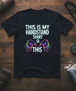 Black t-shirt with "THIS IS MY HANDSTAND SHIRT SI THIS" text and colorful hand graphics, perfect for gymnasts and fitness