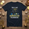 This is my Hanukkah Pajamakah text with menorah and dreidels graphic on navy t-shirt