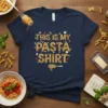 T-shirt with "THIS IS MY PASTA SHIRT" text made of pasta, surrounded by pasta shapes and ingredients