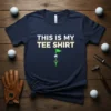 Navy t-shirt with white and gold text reading "THIS IS MY TEE SHIRT" and a graphic of a golf flag
