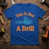 This Is Not A Drill T-Shirt with a blue chainsaw graphic and orange text, designed for humor lovers and mechanics