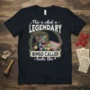 This is what a LEGENDARY BINGO CALLER looks like text with bingo cage and balls graphic on black t-shirt
