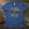 Blue t-shirt with "This Mama Prays" text in gold and black glitter, featuring ornate heart graphics