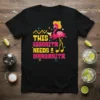 Black t-shirt with "THIS SEÑORITA NEEDS A MARGARITA" text and a cartoon flamingo holding a drink