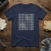 Navy blue t-shirt with repeating white text that reads "this shirt is not a napkin" and subtle splatters
