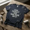 Dark navy t-shirt with white distressed text reading "THIS TOTALLY HAS DOG HAIR ON IT." surrounded by faux dog fur
