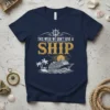 Navy t-shirt with "THIS WEEK WE DON'T GIVE A SHIP" text, nautical wheel, cruise ship, palm trees, and ocean waves