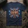Navy blue t-shirt with "three." in distressed orange text, surrounded by gears, pistons, and blue lightning bolts. Perfect for a