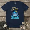 Tia Shark t-shirt design featuring a geometric blue shark with sunflowers and the text "Tia Shark" in playful font
