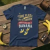 T-shirt with the quote "Time Flies Like an Arrow Fruit Flies Like a Banana" and flying bananas graphic