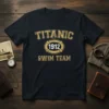 Titanic 1912 Swim Team text in distressed gold font on a dark t-shirt, featuring a life preserver graphic