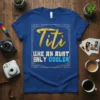 Titi Like An Aunt Only Cooler quote on a royal blue t-shirt, featuring gold glittery "Titi" and blue "Like An