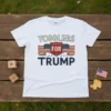Toddlers For Trump t-shirt featuring bold text, American flags, and a shield graphic in patriotic colors