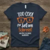 Navy t-shirt with "TOO COOL for Just one Sclerosis!" text and orange glasses with orange ribbons, plus "MULTIPLE SCLEROSIS AWARENESS"